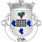 Escudo de prata, com pombal de negro entre um cacho de uvas de púrpura, folhado de verde, em chefe e três seixas de azul, nos flancos e na campanha. Coroa mural de prata de três torres. Listel branco, com a legenda a negro: «UVA».